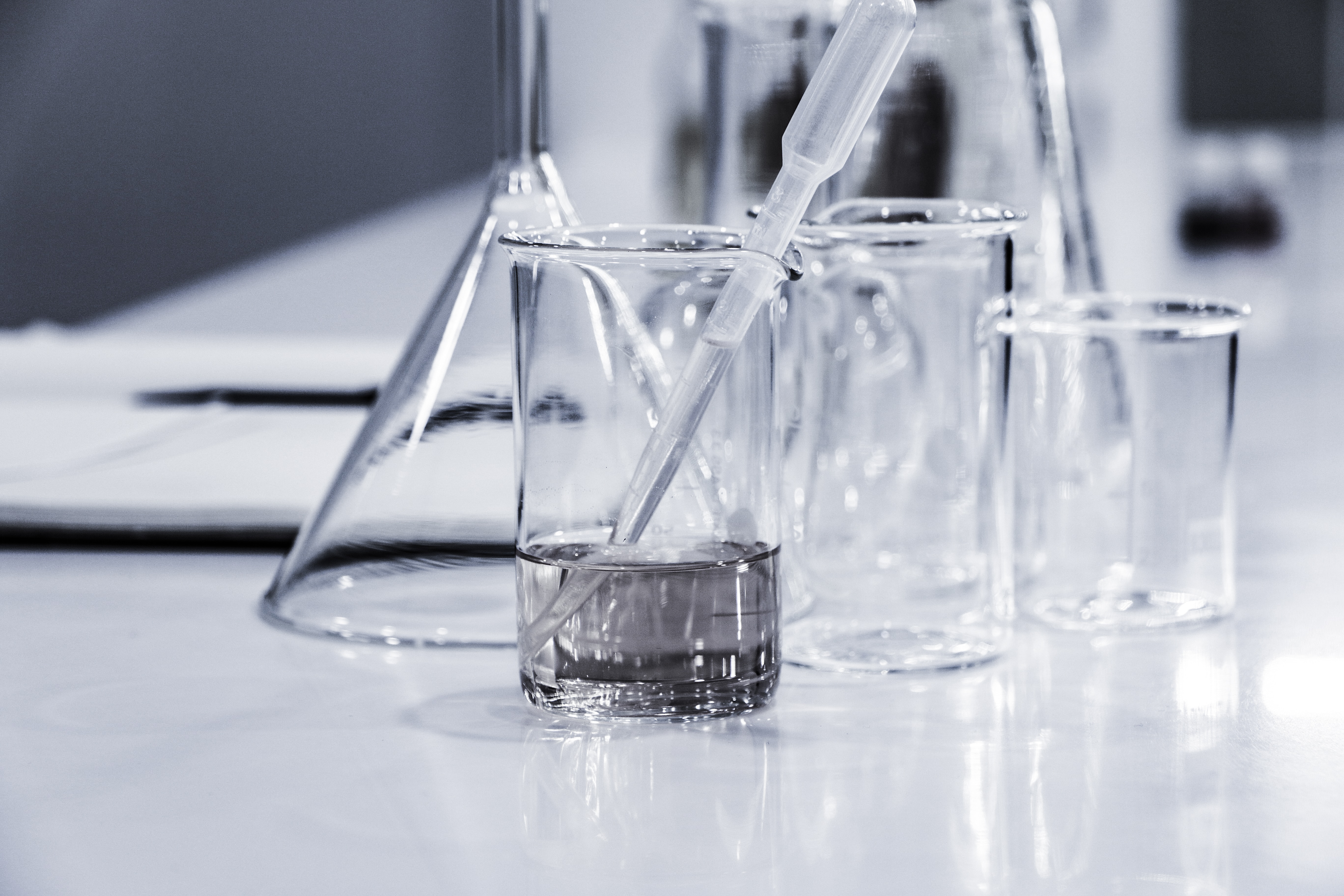 beakers and pipets on a table