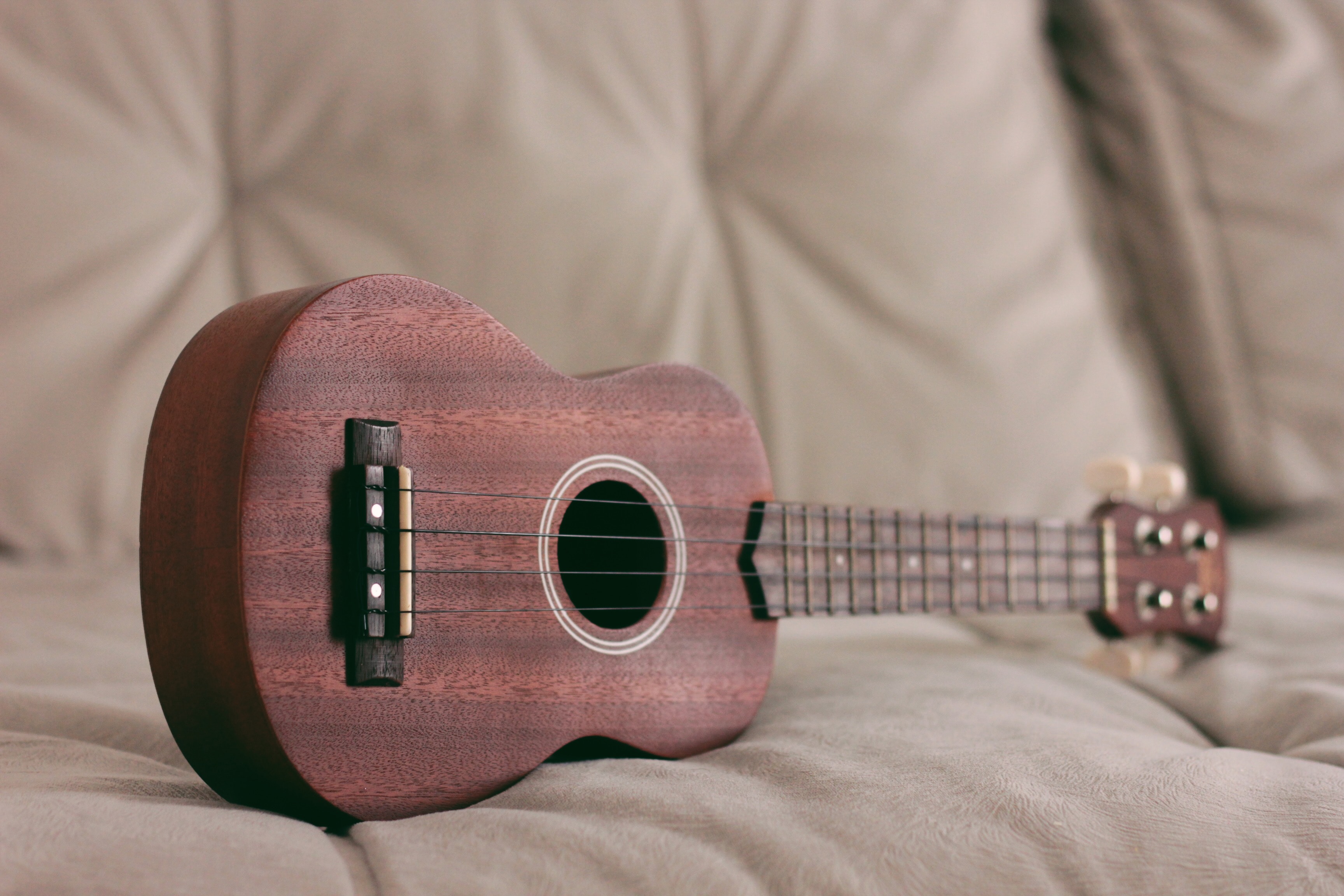 Ukulele sitting on a couch